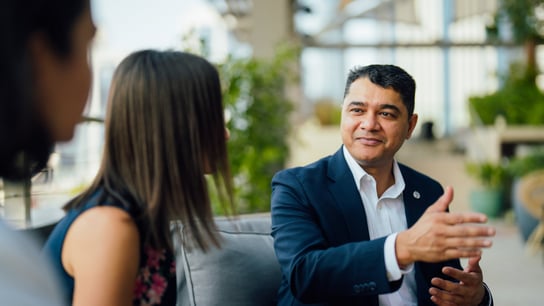 People discussing at a meeting.