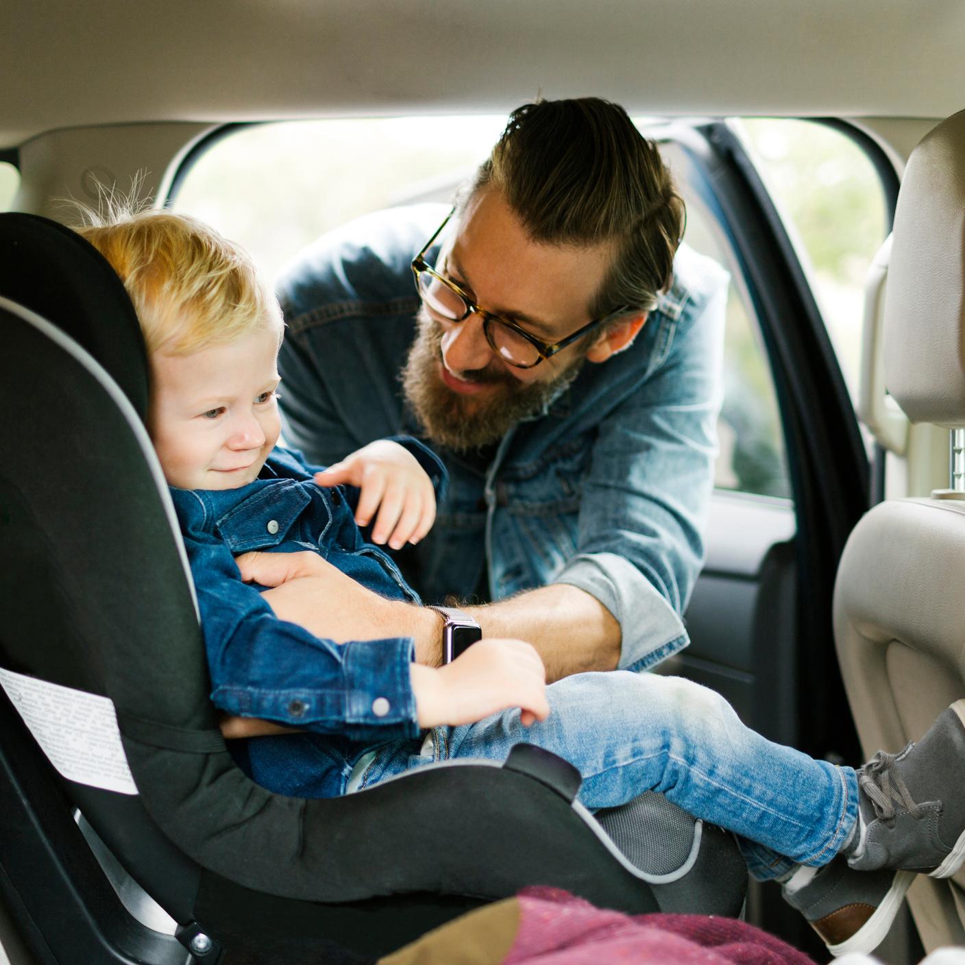 Father and child at the back of the car.
