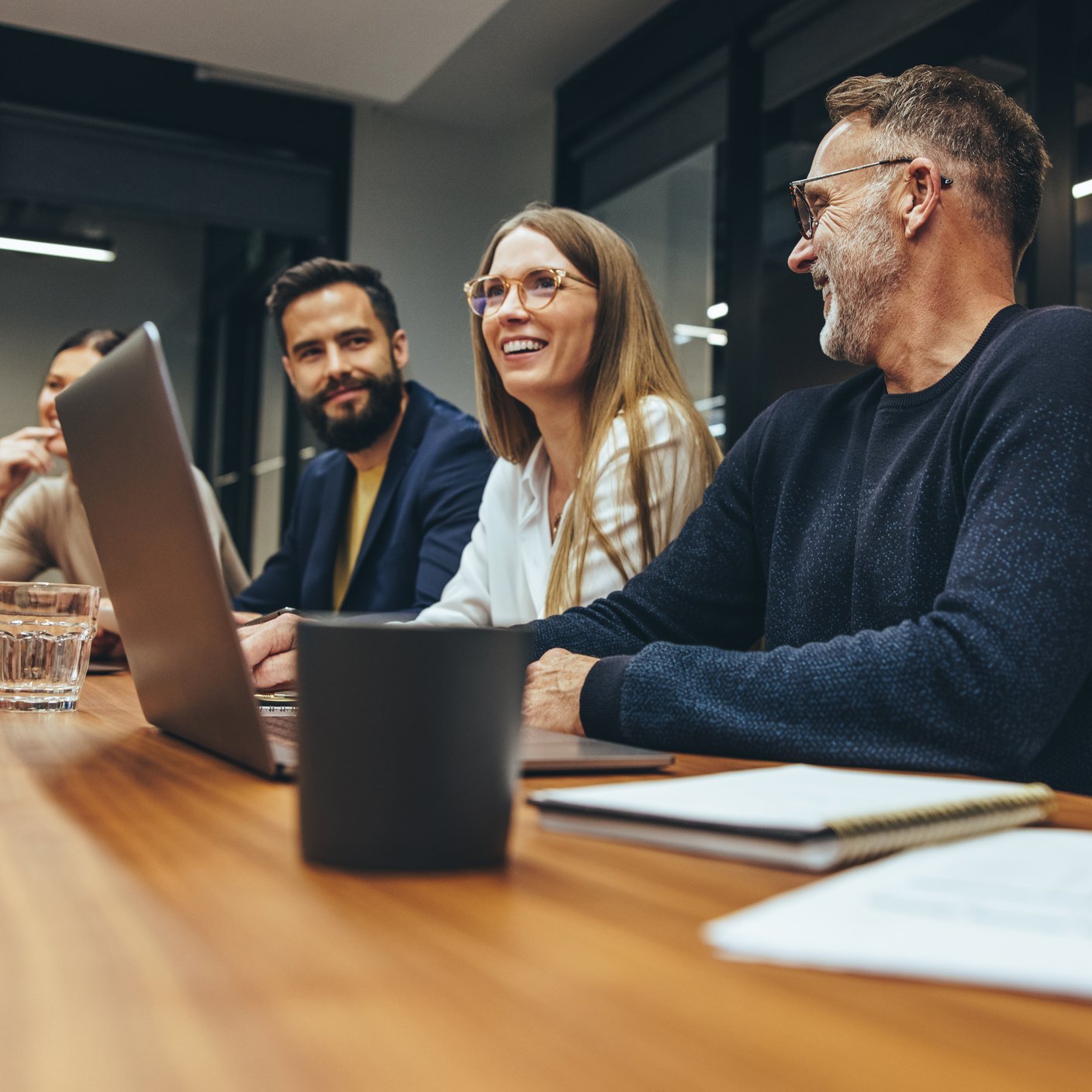 group watching laptop 