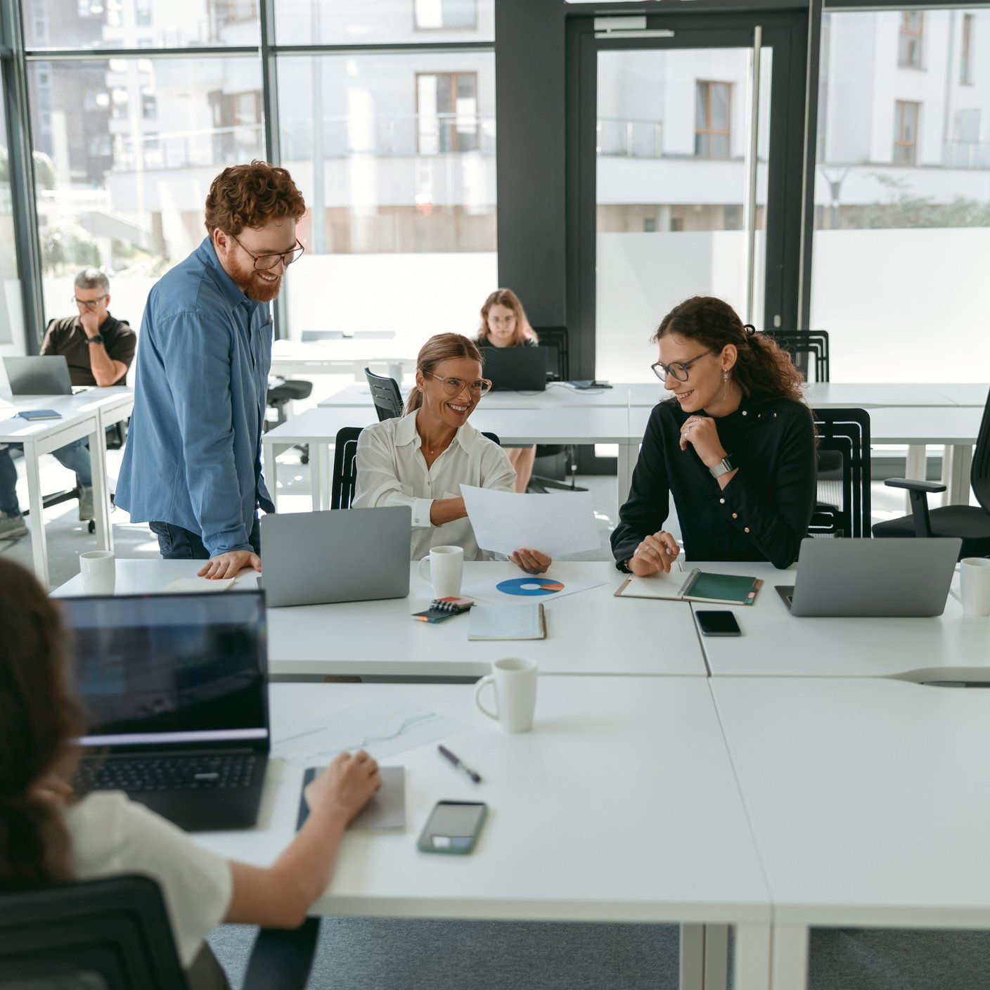Officer works looking at laptop 
