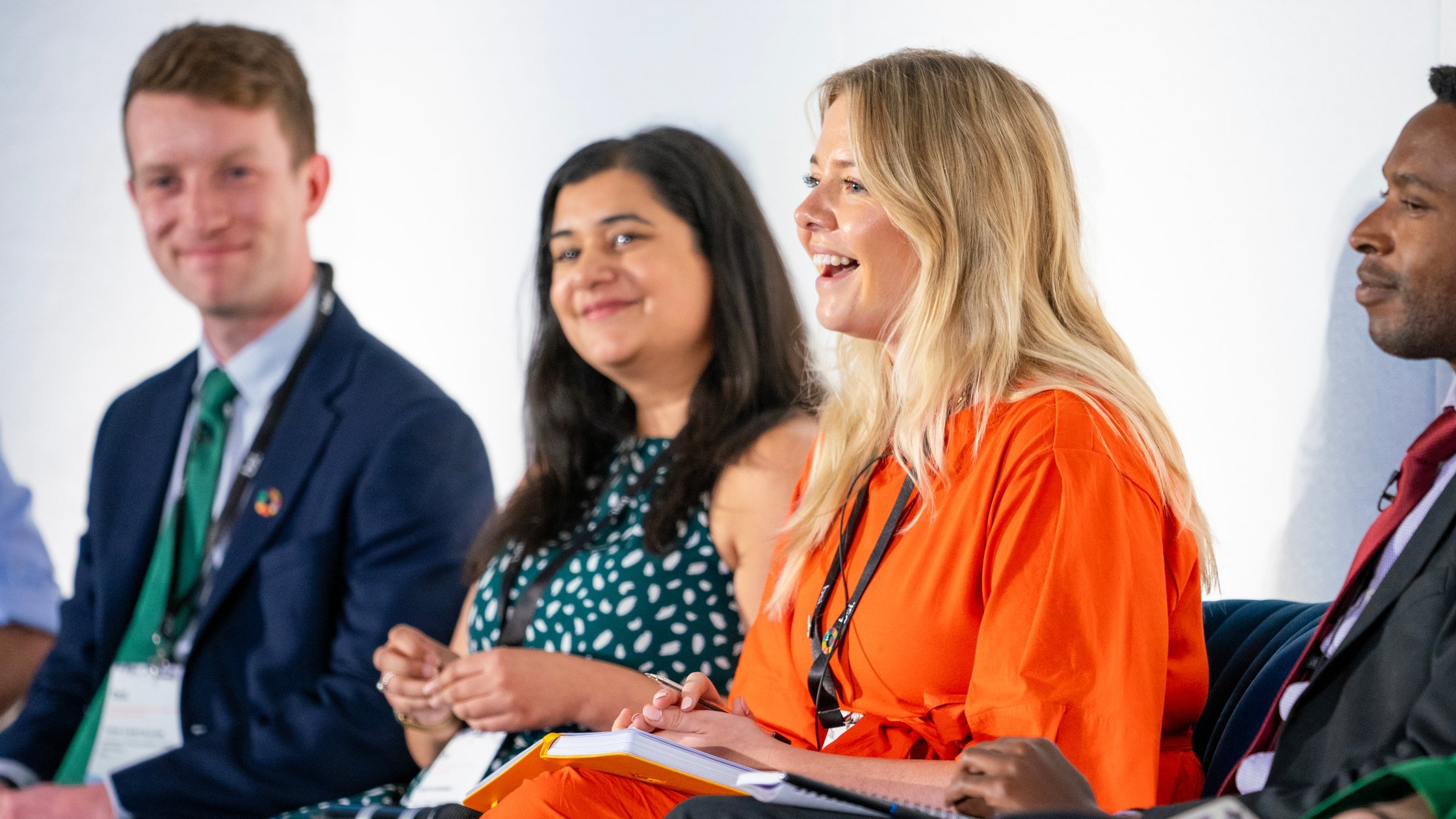 People speaking at a conference.