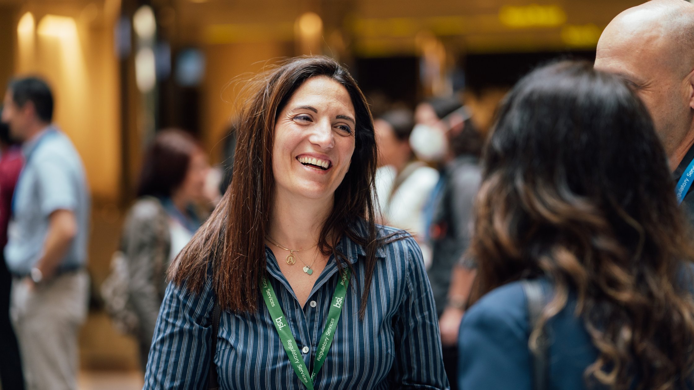 Three executives standing and discussing business